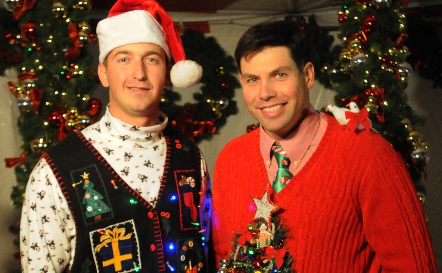 Christmas Party Goers Posing in Their Christmas Ugly Sweaters