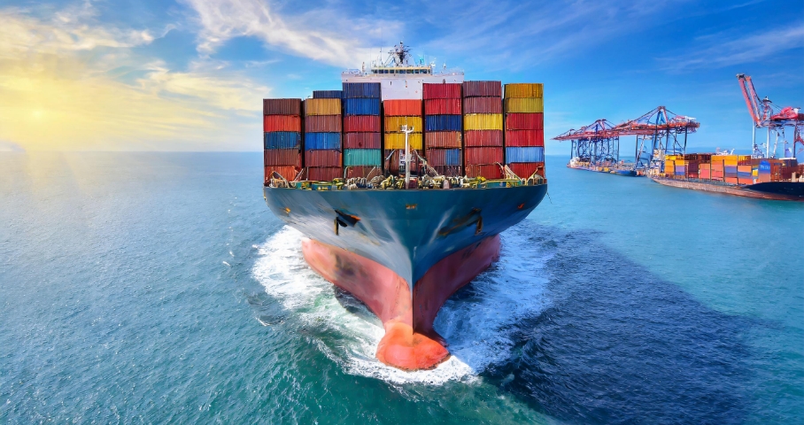 Image of a ship carrying containers over the sea