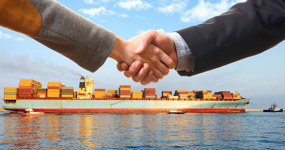 image of shaking hands on a ship